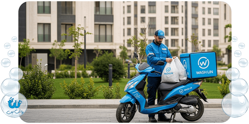 یک پیک واشلین با اسکوتر در مقابل مجتمعی مدرن در غرب تهران، نماد خدمات خشکشویی غرب تهران.