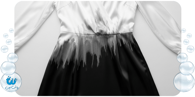 یک لباس مجلسی دوتکه سفید و مشکی که رنگ مشکی آن روی قسمت سفید پخش شده، نماد فاجعه تداخل رنگ.