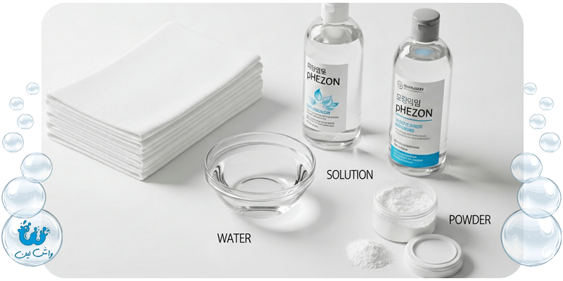 جعبه ابزار لکه بری در خانه شامل پارچه سفید، آب سرد و پودر جاذب برای پاک کردن لکه لباس‌های حساس.